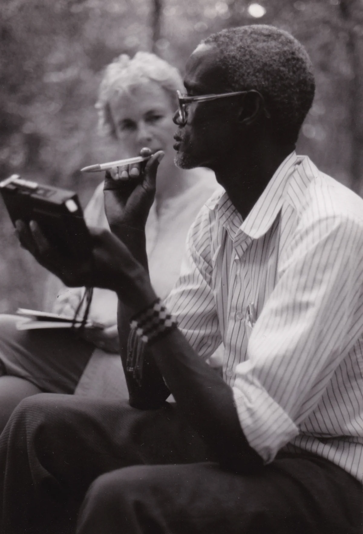 An Anuak storyteller speaks while the session is recorded